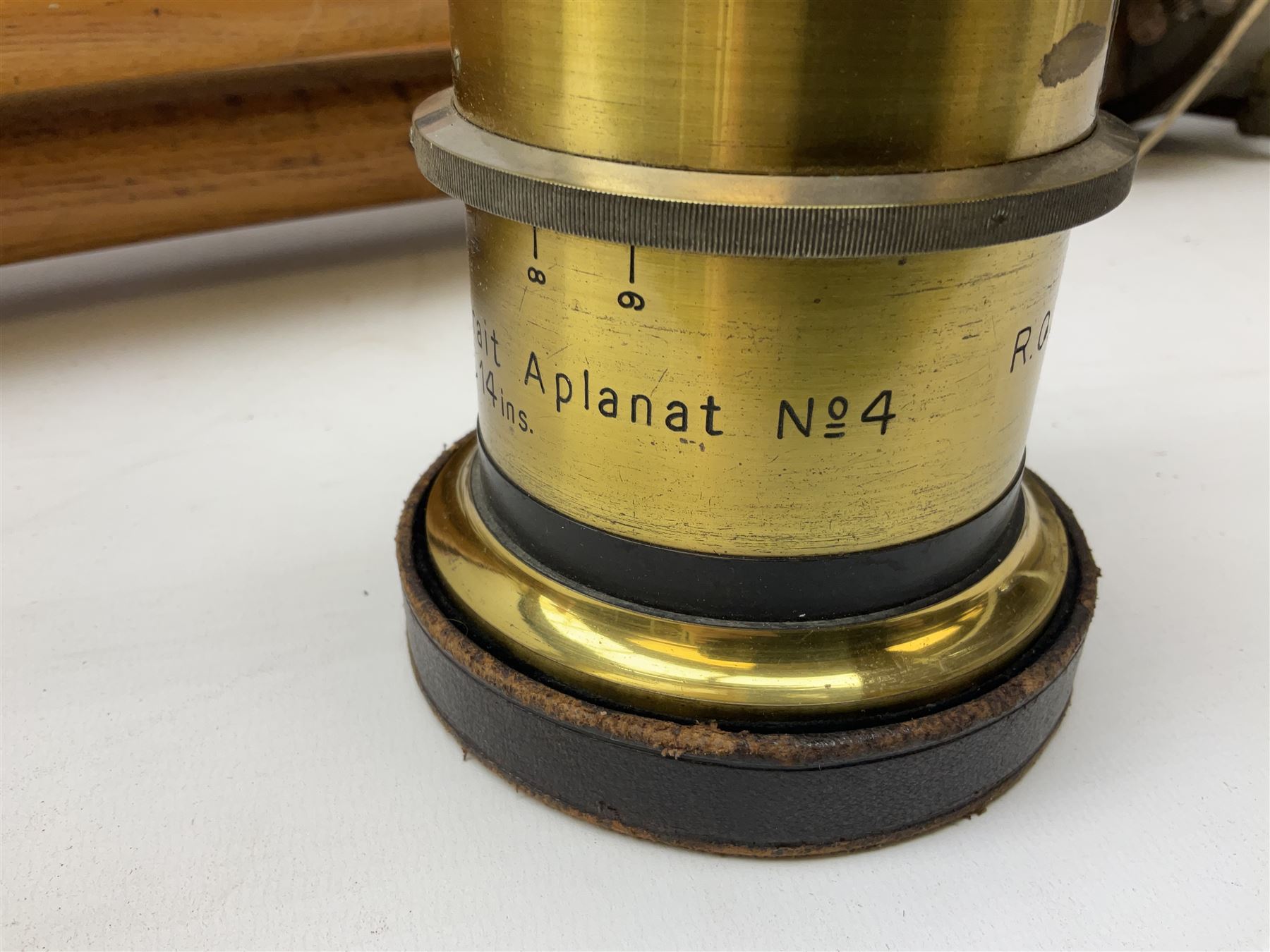 Thornton Pickard folding plate camera in mahogany and lacquered brass, no.529946 and no.529947, field model with canvas wrapped box, three mahogany photographic plates, 'Busch's Portrait Aplanat No4 Foc.14inc' lens and a wooden tripod