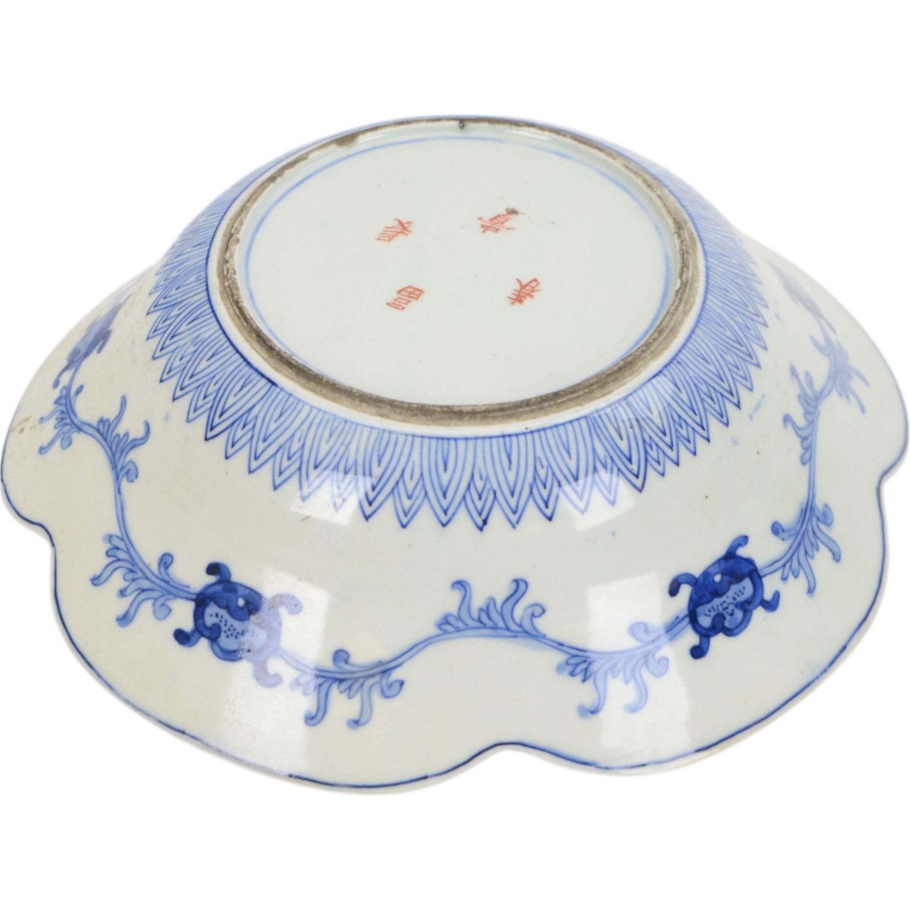 Group of 19th century Japanese Imari porcelain, Meiji period, comprising pair of lobed dishes, decorated stylised reserves and painels in blue and gilt upon a red ground, H6.5cm D21.5cm, a pair of plates of circular lobed form, decorated with a central panel depicting a vase beneath pine branches, and surrounded by panels of flowers and stylised quatrefoil shapes, D21cm, and another similar example painted with a character in underglaze blue to the centre, with character mark beneath, D22cm, each with character marks beneath               