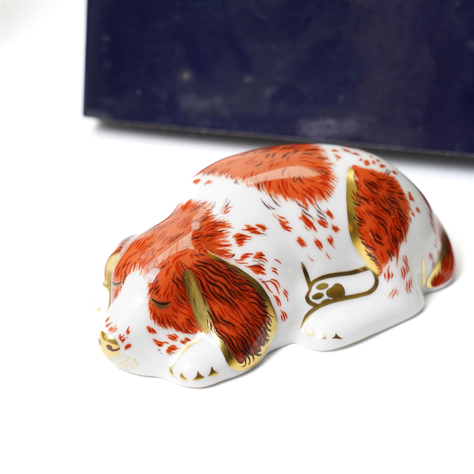 Six Royal Crown Derby paperweights comprising 'Hawthorne' hedgehog with gold stopper, baby rabbit with gold stopper, 'Molly' dog guild exclusive with gold stopper, farmyard hen with gold stopper, woodland squirrel with gold stopper, and collectors guild puppy with gold stopper, all boxed (6)