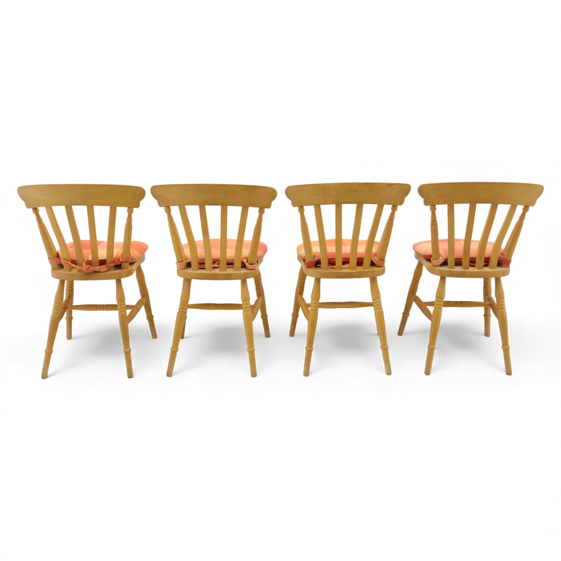 Late 20th century pine farmhouse dining table, rectangular top raised on turned legs, together with a set of matching spindle-back chairs with padded seats