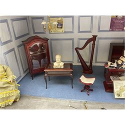 Scratch-built illuminated wooden doll's house type display of 'The Old Music Box' music shop, the hinged front opening to reveal a single room furnished with counter, piano, harp, figures, display cabinets, violin, saxophone and other musical instruments and accessories L51cm H28cm D29cm