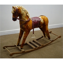  Late 20th century red and gold rocking horse, with bridle, saddle and stirrups, L145cm  