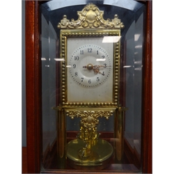 Early 20th century mahogany and bevelled glass cased torsion clock by 'Gustav Becker', silvered Arabic dial with ornate pediment and gilt bead border, back plate stamped 'G.B Medaille D'or 1801805', H32cm  