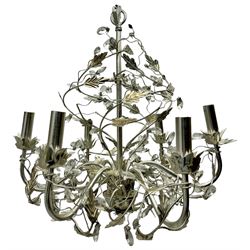 India Jane - silver finish metal chandelier, modelled with scrolling vines and leaves, embellished with faceted glass drops, fitted with six candle sconces, and wired for electricity
