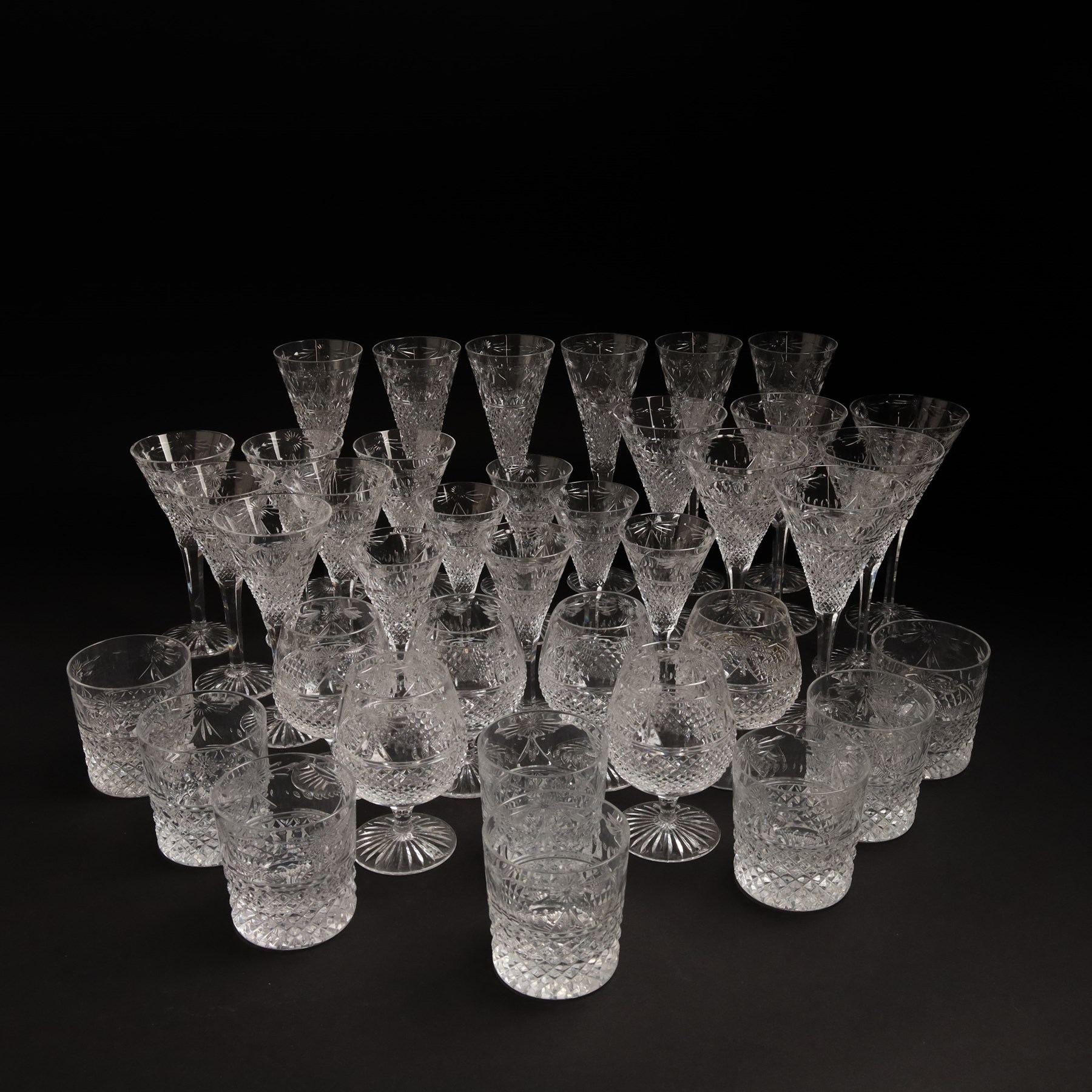  Suite of Stuart crystal Beaconsfield pattern table glass, comprising 6 claret glasses, 6 white wine glasses, 6 dessert wine glasses, 6 brandy balloons, 6 champagne flutes, and 8 whisky tumblers