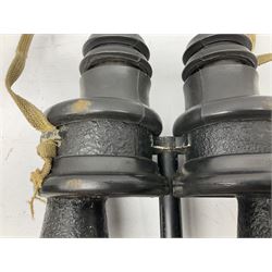 Pair of WWII German U-boat binoculars probably 7 x 50 by Leitz, with rubber eye piece protector covers and leather case stamped with Kriegsmarine mark to the lid and dated 1944, with leather strap.