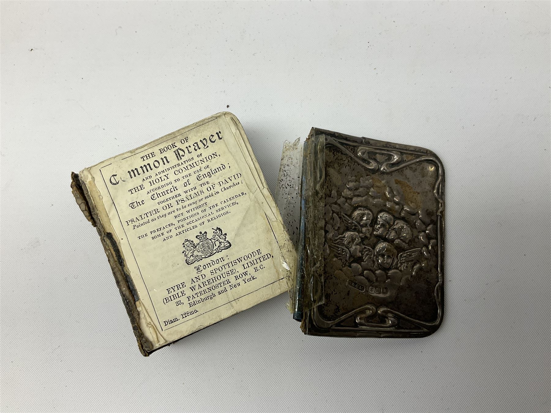 Group of silver, to include filled figure of a pheasant, hallmarked for London, pair of silver mounted horn napkin rings, miniature Edwardian bible with silver cover embossed with putti, Victorian silver brooch, ebonised plinth with applied inscribed silver shields, etc., together with two stick pins, one example with 9ct gold terminal 