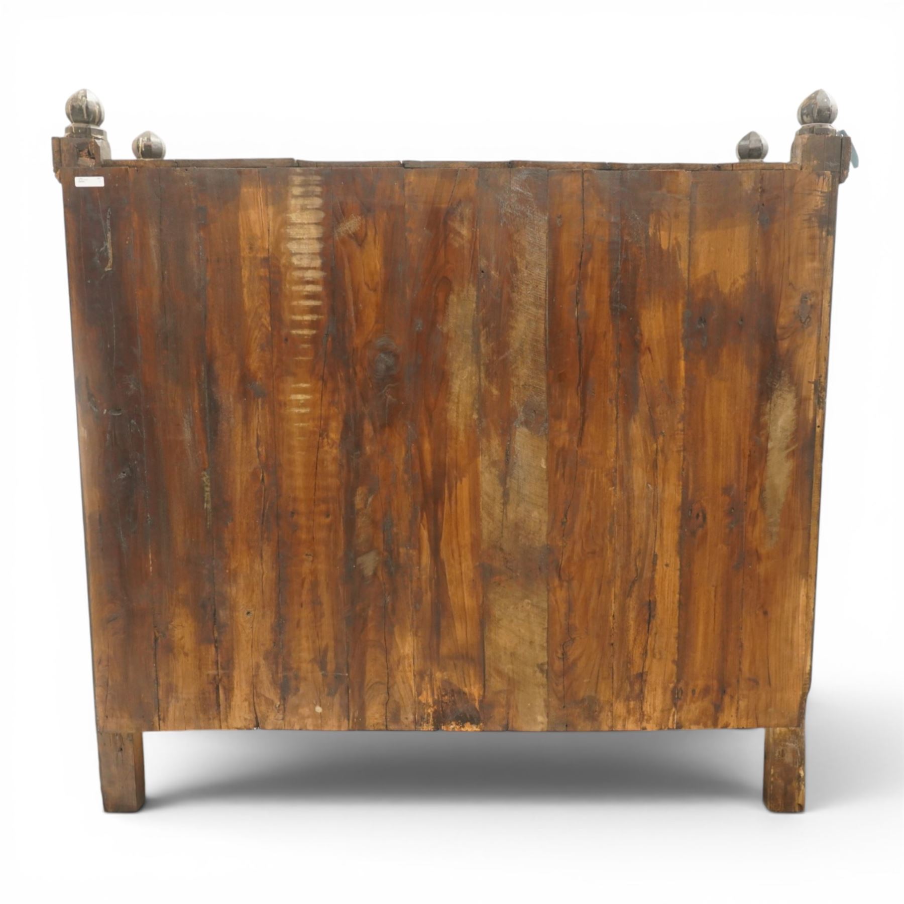 19th century oak hutch cupboard, plank top with moulded cornice and turned finials, panelled front enclosed by two tiers of central double doors with iron hinges and wooden latches, flanked by fixed fielded panels, on stile supports