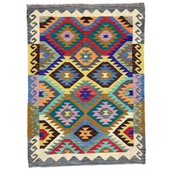 Anatolian Turkish Kilim rug, multi-coloured ground, decorated with geometric stepped lozenges with in a scrolled border