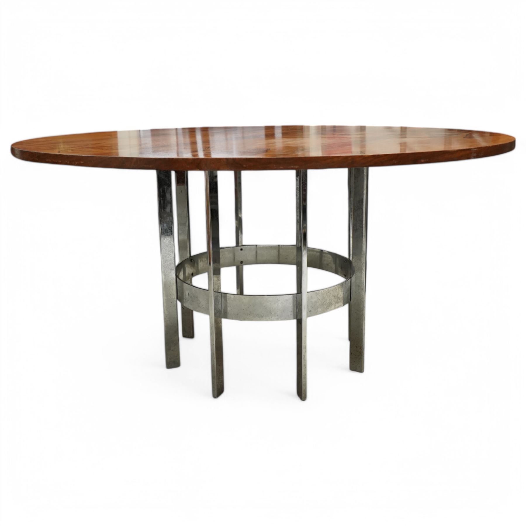 Mid-century Merrow Associates rosewood and chrome dining table, the circular top with striking rosewood veneers, raised on a chromed steel base of eight supports joined by a central ring stretcher