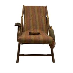 19th century teak campaign steamer or garden chair, folding staggered mechanism with brass fittings, upholstered seat, back and arms