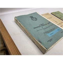 Collection of nineteen British Army booklets 1940s - 1970s including Small Arms Training 1944, various Infantry Training, Cadet Training Manual 1978, Signal Training, Commander's Aide Memoires etc; 1950s blue beret with Yorks Brigade badge; part travelling toilet set in cloth roll; all contained in pine box with webbing straps