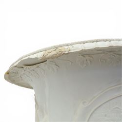 Pair of composite campana urns on stands, the urns decorated with relief figural panels and foliate bands with scrolling handles, on circular socles, the pedestals of square tapering form with moulded edges and applied classical motifs