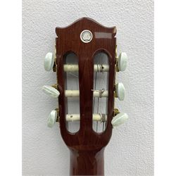 Nagoya Suzuki Model SC240 acoustic guitar with mahogany back and ribs and spruce top, bears label, L101cm; in soft carrying case