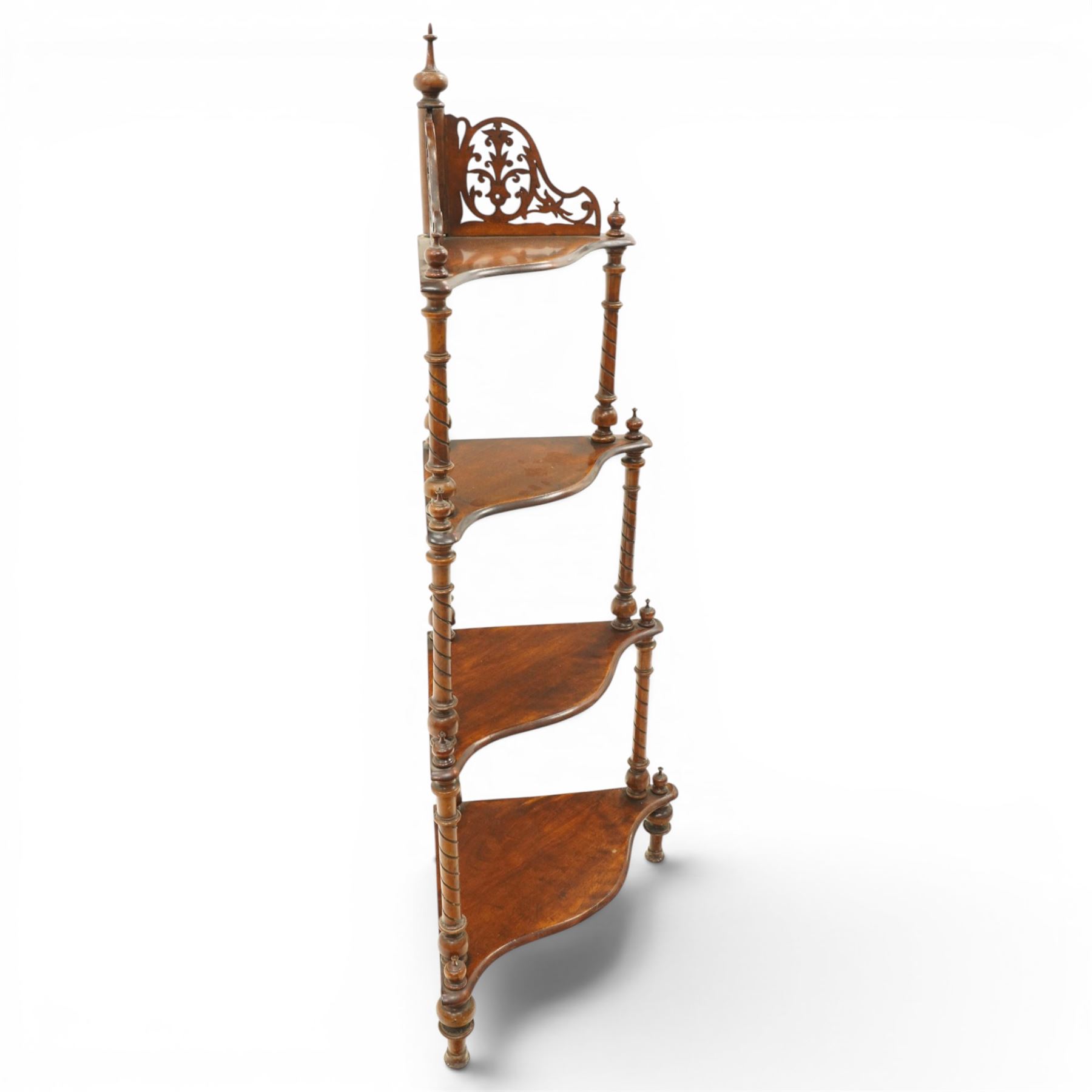 Victorian mahogany corner four-tier whatnot, shaped shelves with pierced and turned uprights, raised on turned supports