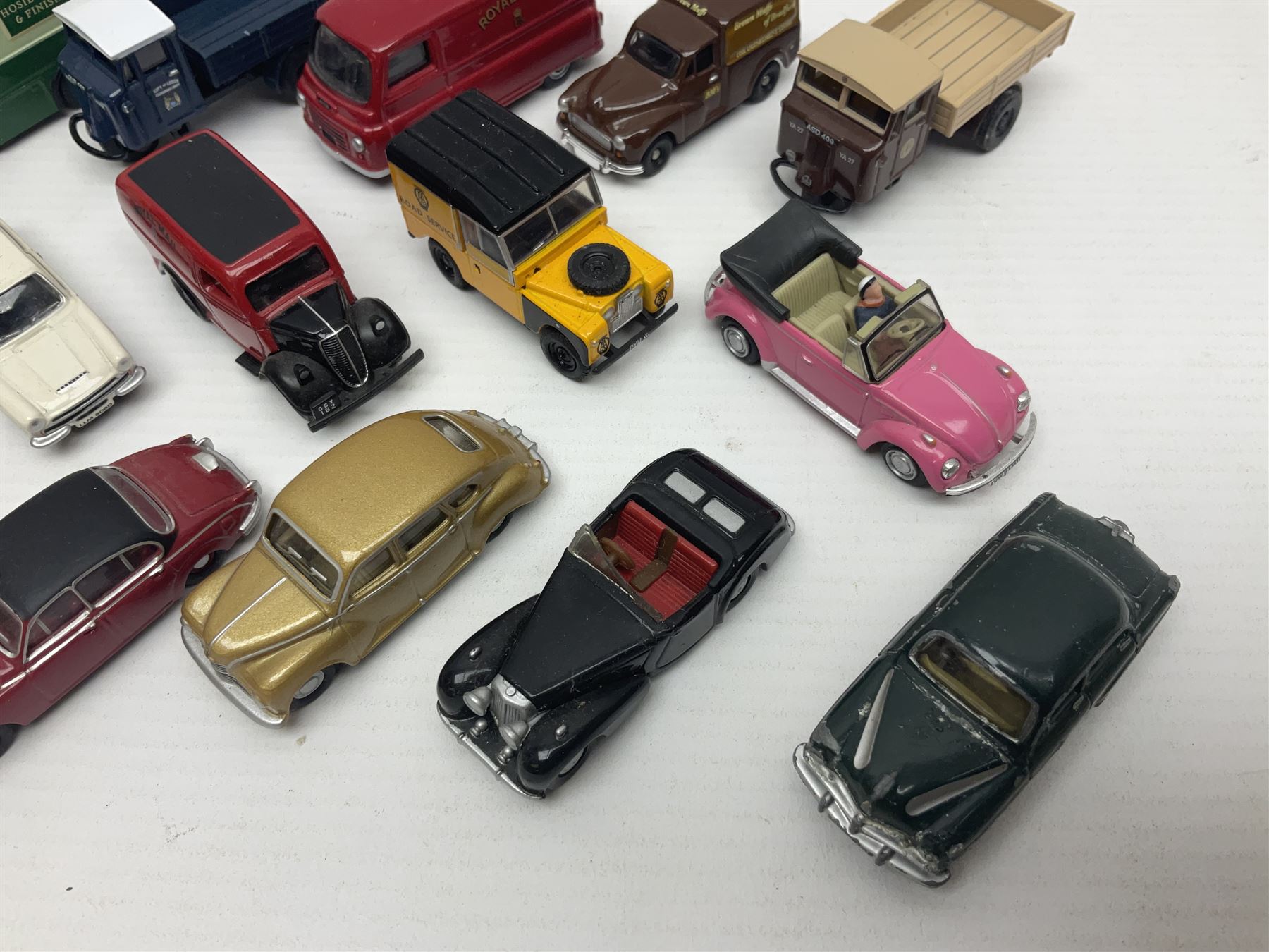 Over forty 1:76 scale die-cast models of cars and commercial vehicles; some boxed; and eight small scale models of motorcycles; all unboxed