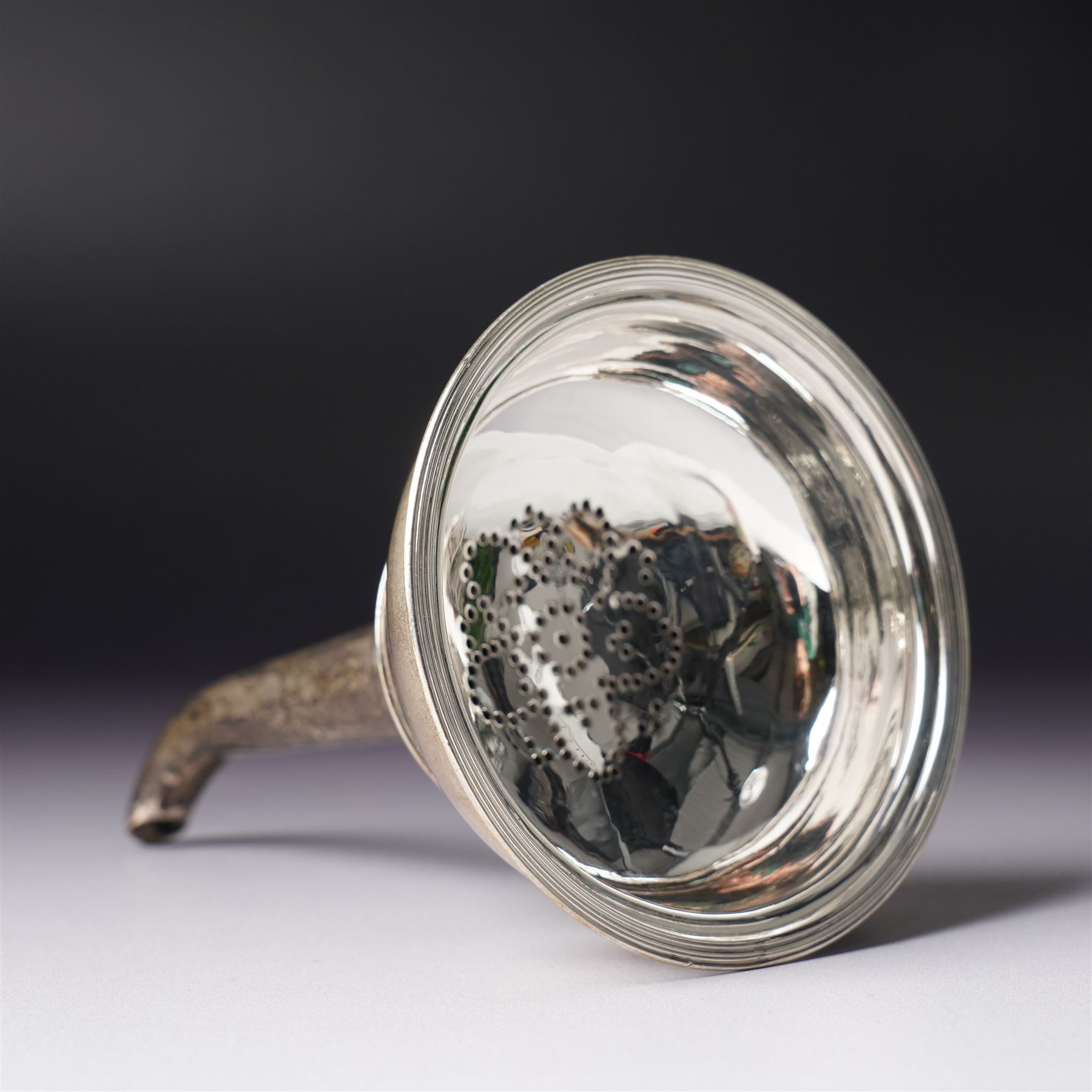 Early 19th century silver wine funnel with small circular stand engraved with a crest, makers mark on stand PG