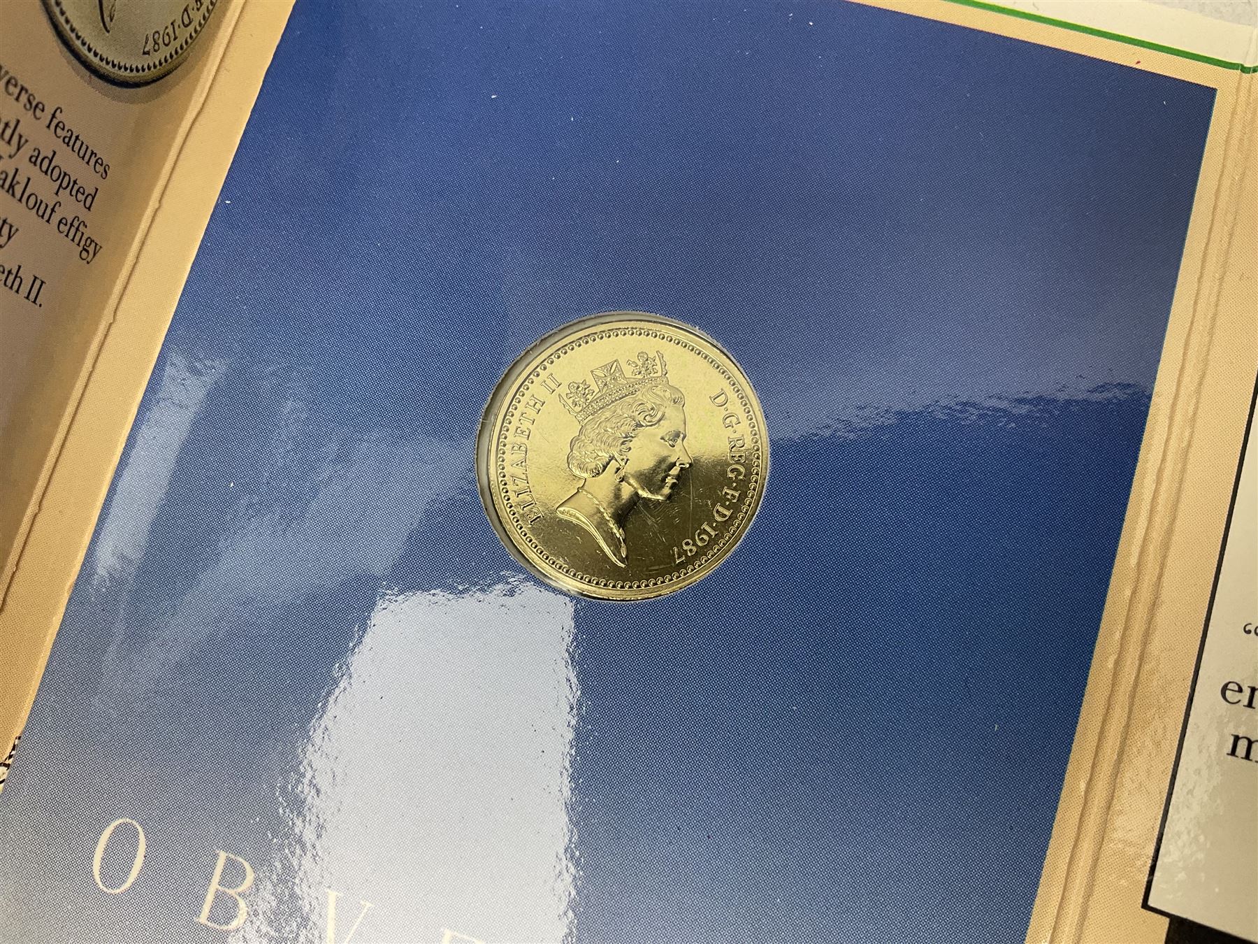 Two Great Britain and Northern Island proof sets dated 1970 and 1971, both with card cases, three 1986 Commonwealth Games commemorative two pound coins, in card folders, and six brilliant uncirculated one pound coins, in card folders