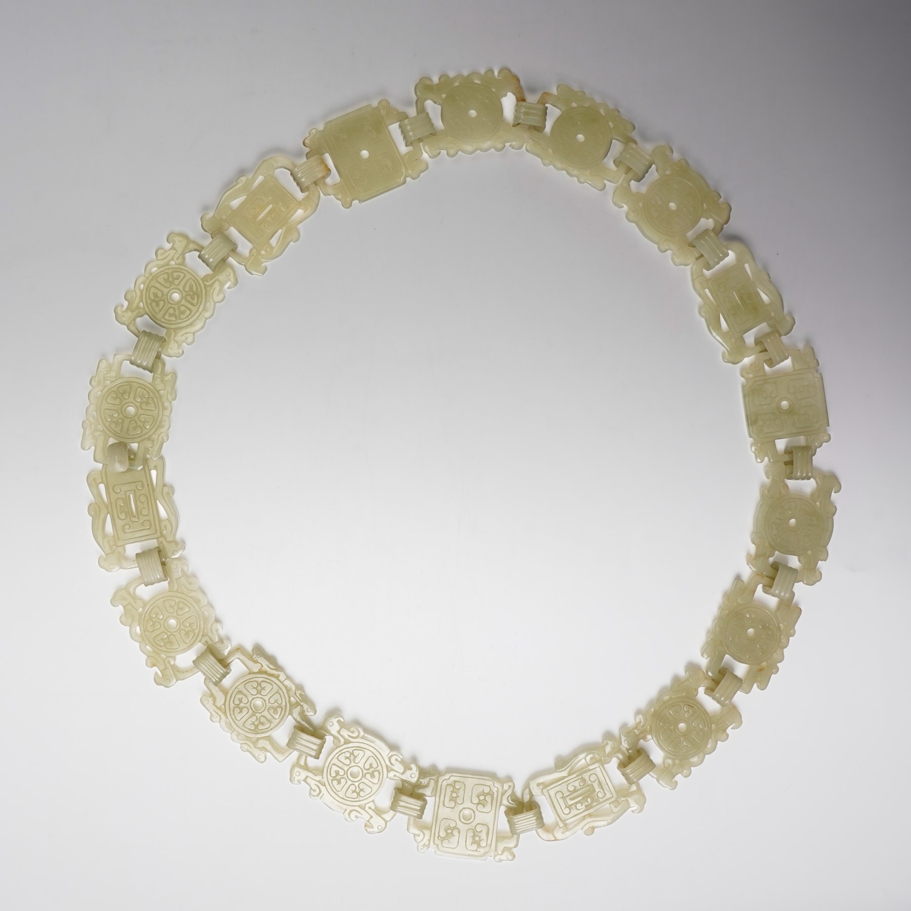 Chinese carved greenstone belt, each link carved with symbols, W108cm 