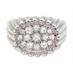 White gold diamond ring, fifteen pave set round brilliant cut diamonds, in an oval setting...