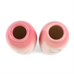 Pair Ault Pottery vases, decorated with swallows in flight upon a pink ground, H22cm