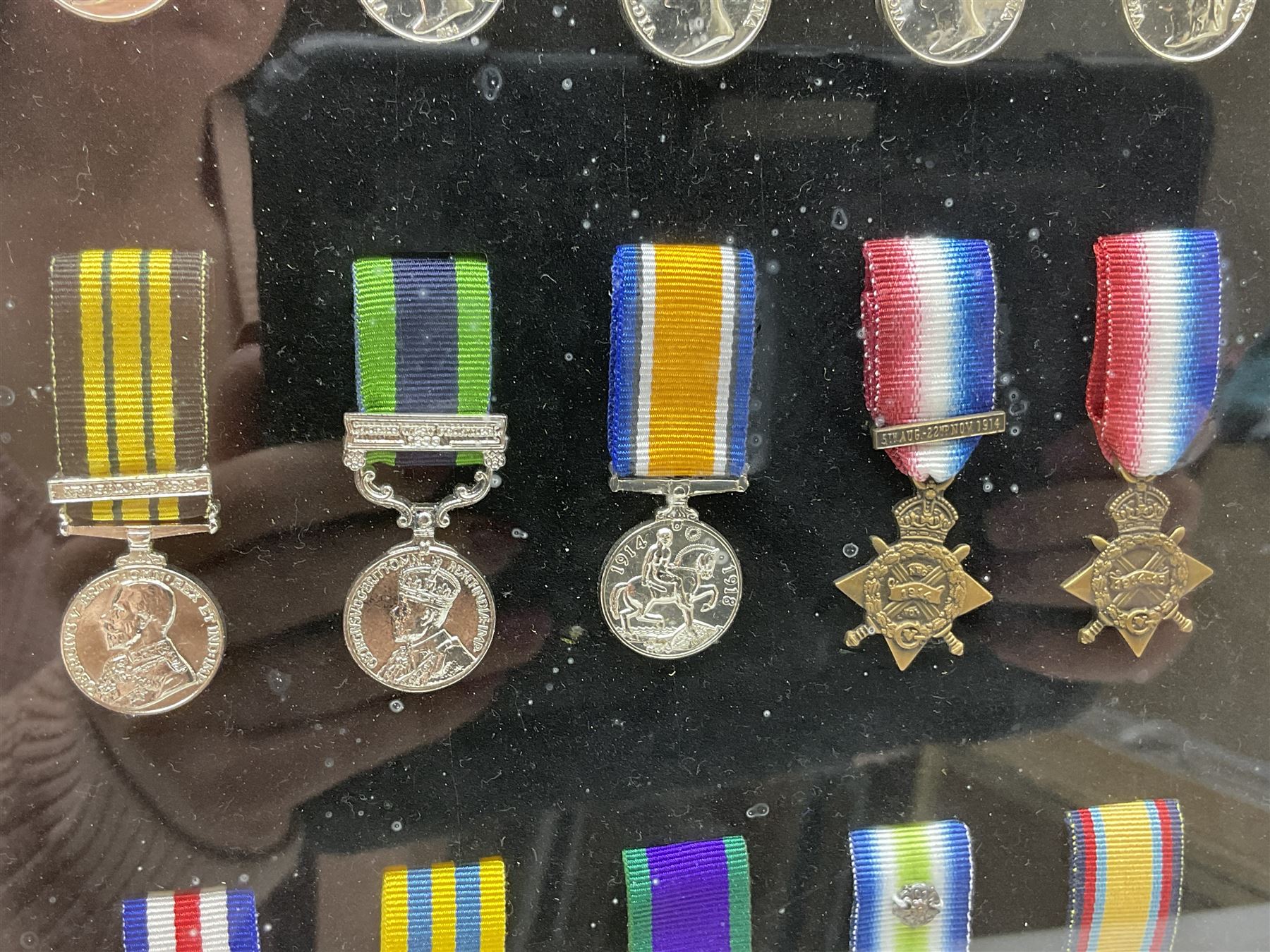 Limited edition large framed display board with sixty half-size copies of British Gallantry and Campaign Medals produced by Danbury Mint; all with ribbons and associated booklet
