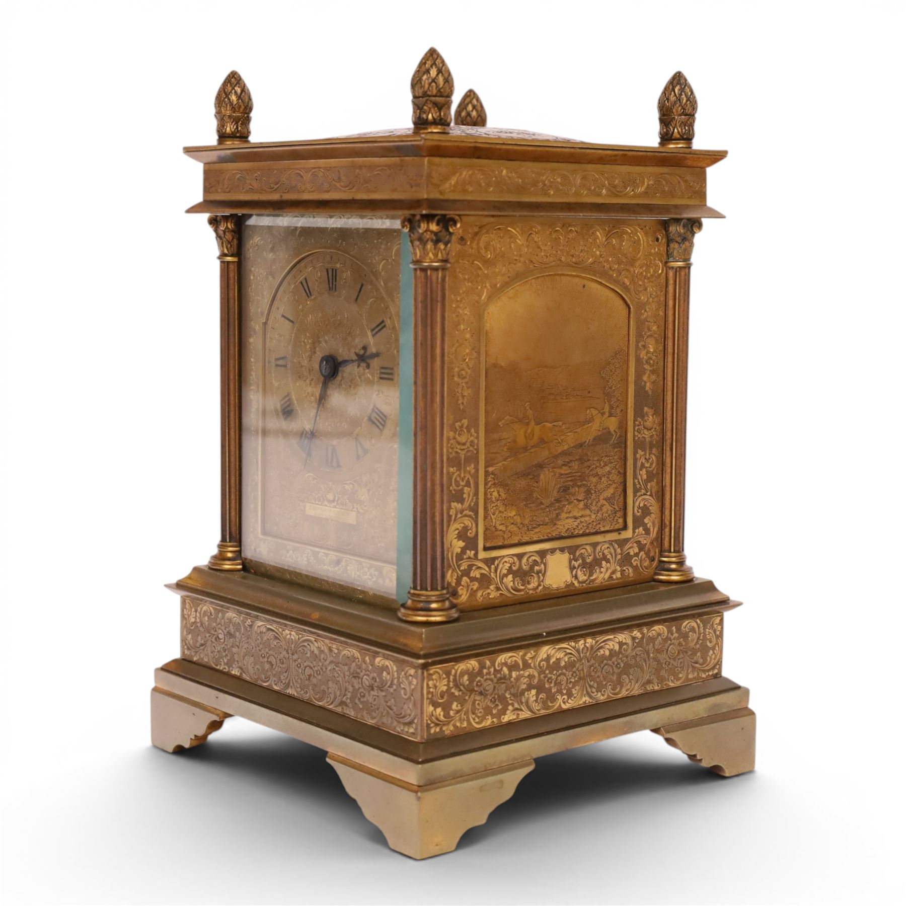 Early 20th century brass mantle clock, the face and case profusely engraved with floral scrolls, the sides inset with hunting scene panels, flanked by four Corinthian columns with acorn finials, striking the hours and halves on bell, H20.5cm W13cm