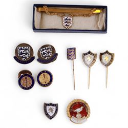 England football enamel buttons, badges and pins, including rolled gold tie clip and pin with enamelled three lions emblem, two FA Tour 1961 buttons/badges and an FA Coach enamel badge/pin, together with a dark blue tie with light blue three lions emblems, three Leicester City enamel tie pins and a Scarborough FC 'No Battle No Victory' enamel badge, all from the estate of former Leicester City player and Scarborough FC manager Colin Appleton