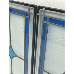Two double glazed stained glass panes, mottled glass with a blue band border and three diamonds 