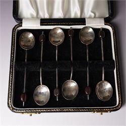 Set of six silver seal top coffee spoons and tongs Sheffield 1924 Maker Cooper Bros & Sons Ltd, cased and a set of six silver bead knop coffee spoons, cased