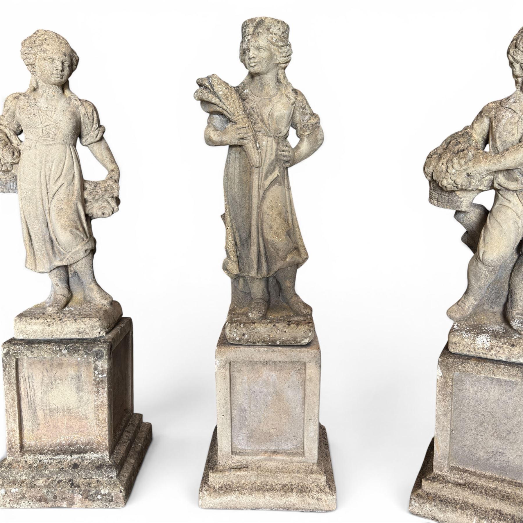 The Four Seasons - set of four traditional cast stone garden figures, in a weathered finish, stamped 'Lucas'