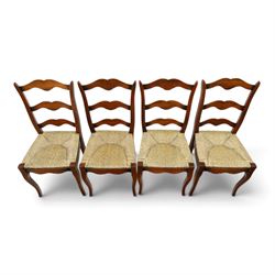 French cherry wood extending dining table, rectangular top on square chamfered supports with two additional leaves; with Batheaston - set of eight cherry wood waived ladder back dining chairs with rush seats (W46cm H98cm)