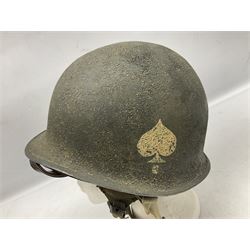 American first type paratrooper helmet with post-WW2 strap and D-rings and later 1944 liner bearing Firestone Tyre and Rubber Company mark; green textured finish
