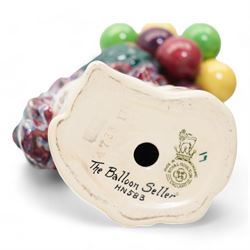 Four Royal Doulton figures comprising 'Sweet Lavender' HN1373, 'The Balloon Seller' HN583, 'Biddy Pennyfarthing' HN1843 and 'Silks and Ribbons' HN2017 (4)