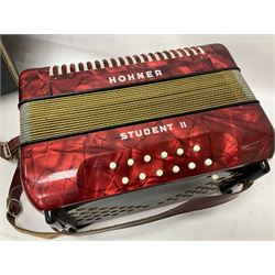 German Hohner student II compact accordion with 26 keys and 12 bass registers in a hard case With tutor