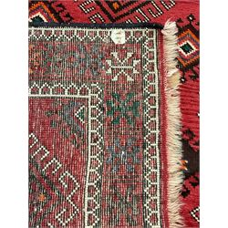Turkish red ground rug, geometric patterned field, repeating border 