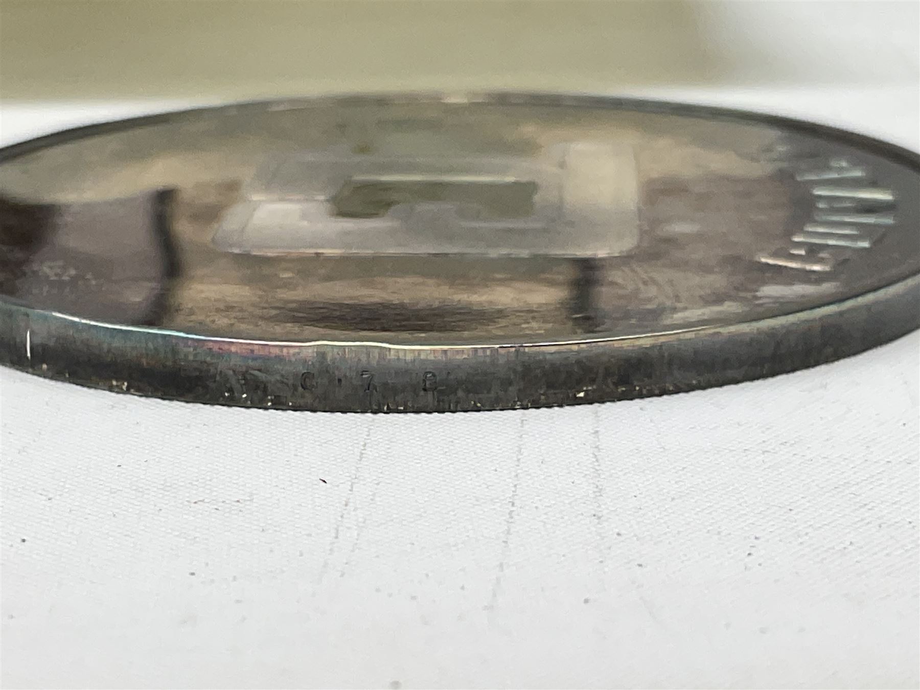 Silver 1969 Cunard RMS Queen Elizabeth maiden voyage commemorative medallion, in original Slade, Hampton & Son case with certificate, two Stratton R.M.S Queen Elizabeth mirror compacts, Stratton R.M.S Queen Mary compact, mid 20th century P&O Canberra Round World Voyage miniature globe, S.S Oriana ash tray modelled as a barrel, Norah Wellings sailor doll, and other maritime and shipping memorabilia 