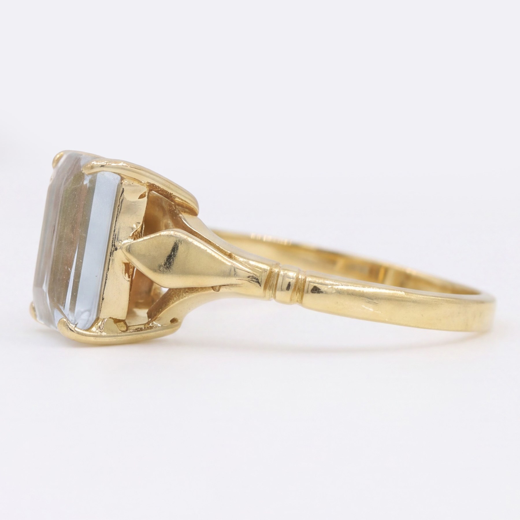 Early - mid 20th century gold aquamarine ring, four claw set with a single emerald cut aquamarine of approx 1.40 carat, stamped 18ct