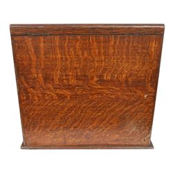 Victorian oak perpetual calendar roll-top desk, tambour front enclosing fitted interior with pigeonholes and pen trays, the raised back fitted with rotating date and month apertures, over single frieze drawer with cast brass handle, on plinth base