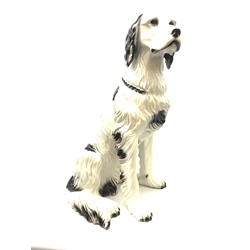A large composite model of a dog, possibly an English Setter, in seated pose, H68.5cm. 