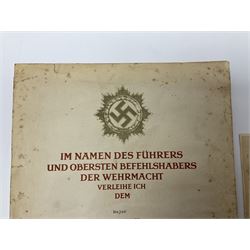 Three German documents dated 1942 - Gold Cross award to Major Ludwig Osterkampf; and Crete wound certificate and cuff title certificate awarded to Feldwebel Alfred Glaise; all unframed (3)