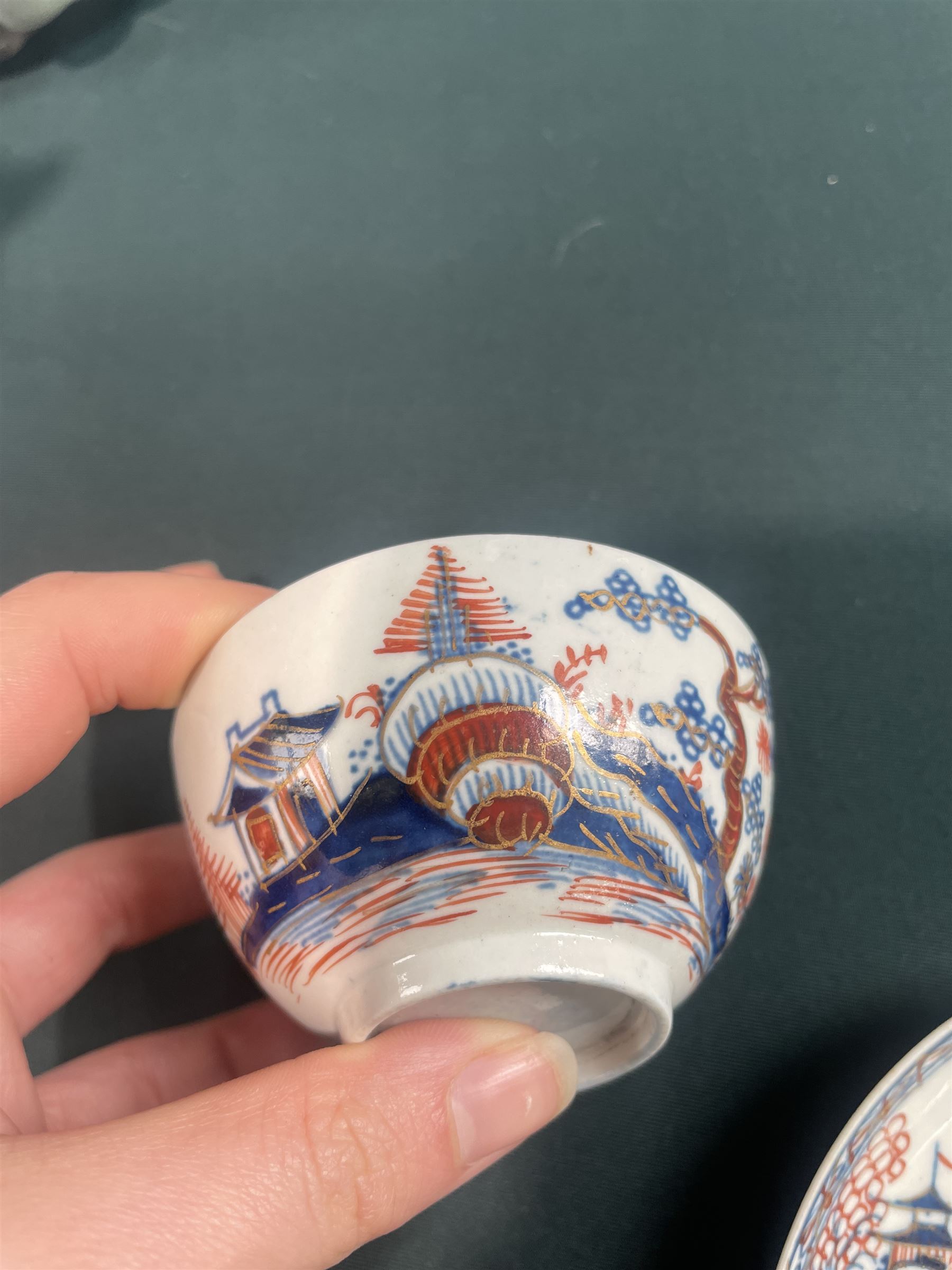 18th century Caughley tea cup and saucer of fluted design decorated in blue and gilt, blue 'S' mark, Bloor Derby coffee can and saucer in red, blue and gilt; 18th century Worcester tea bowls decorated in the Pleasure Boat or Fishermans pattern, and a Liverpool tea bowl decorated in the Penningtons Cannonball pattern