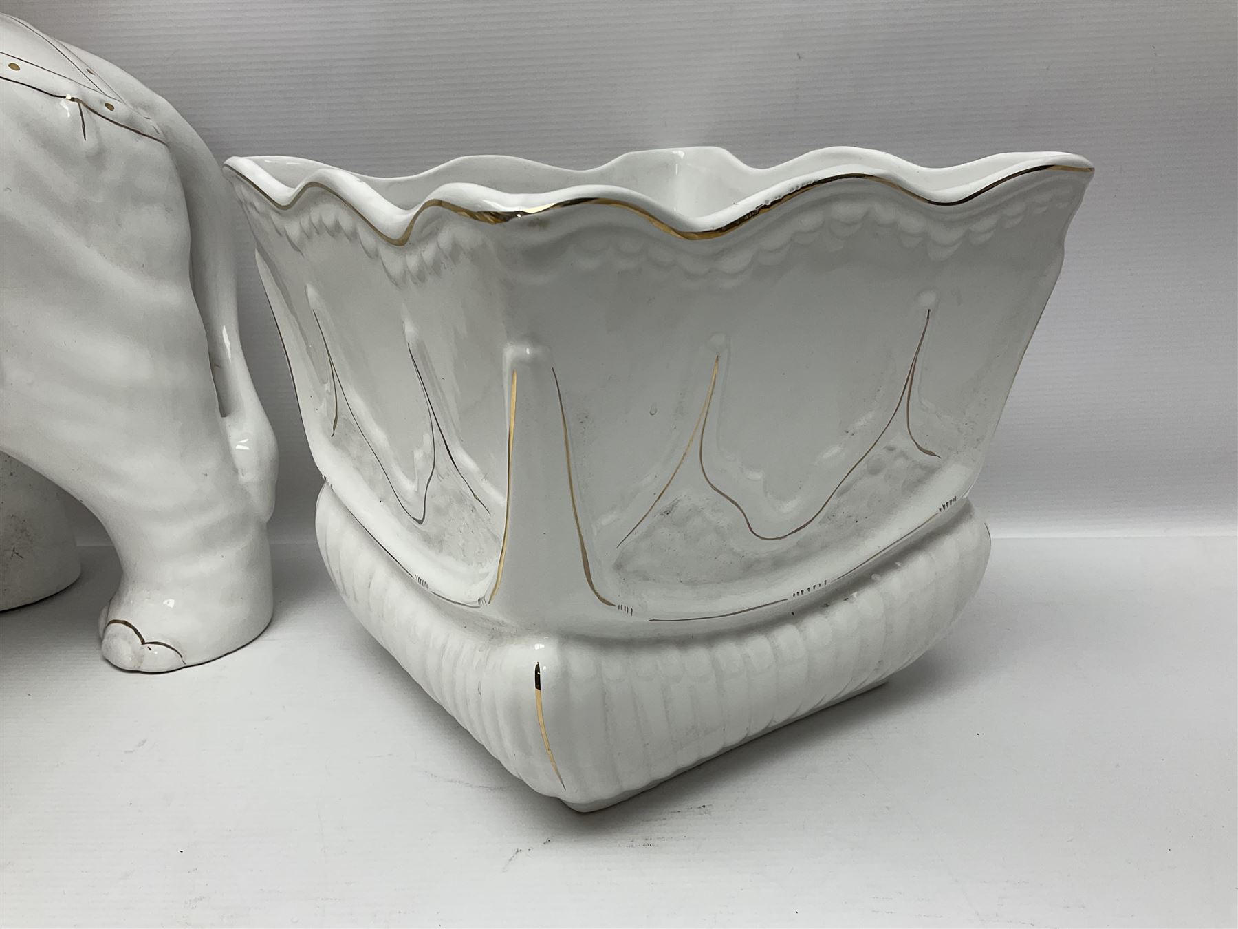 White glazed elephant jardiniere stand; Capo di Mote table centre-piece; and French game-pie dish