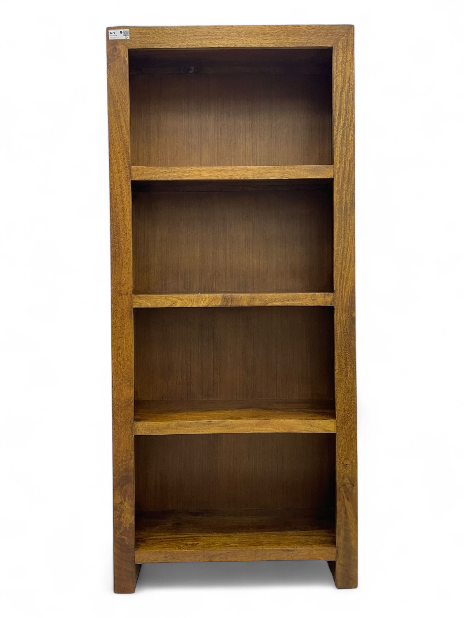 Contemporary Dakota mango wood open bookcase, rectangular form with four fixed open shelves, raised on stile supports