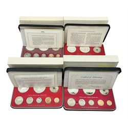 Four Papua New Guinea proof eight coin sets, from ten kina to one toea, comprising First Coinage of Papua New Guinea 1975 proof set, 1976, 1977, and 1979 proof sets, the 1977 and 1979 sets containing 925 silver ten kina and 500 silver five kina coins, all minted at the Franklin Mint, cased with certificates (4)