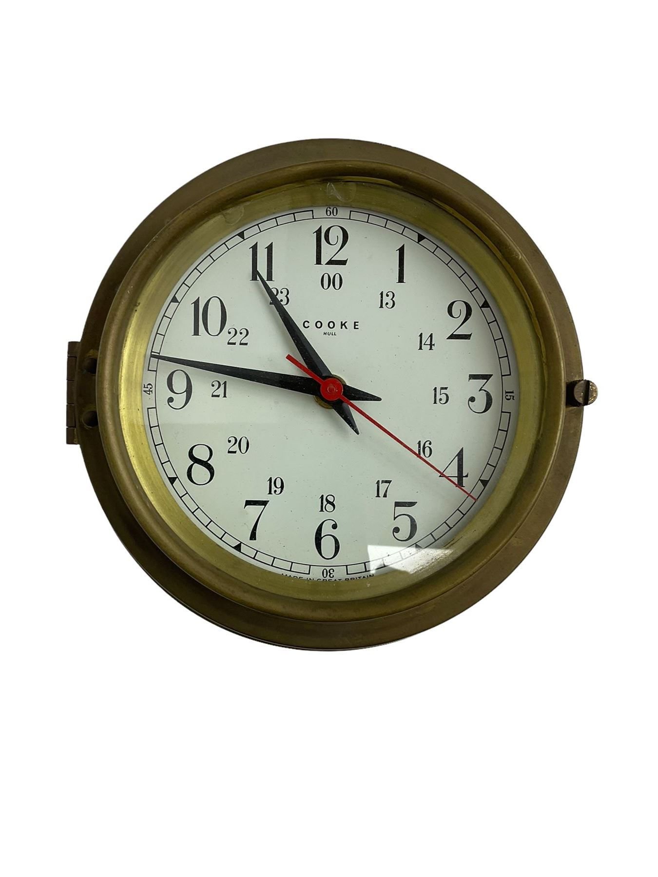 Contemporary quartz timepiece in the style of a ship’s bulkhead clock, with a 5” dial and 9” spun brass case, with a white 24-hour dial, baton hands and seconds sweep hand, dial inscribed “Cooke” Hull.