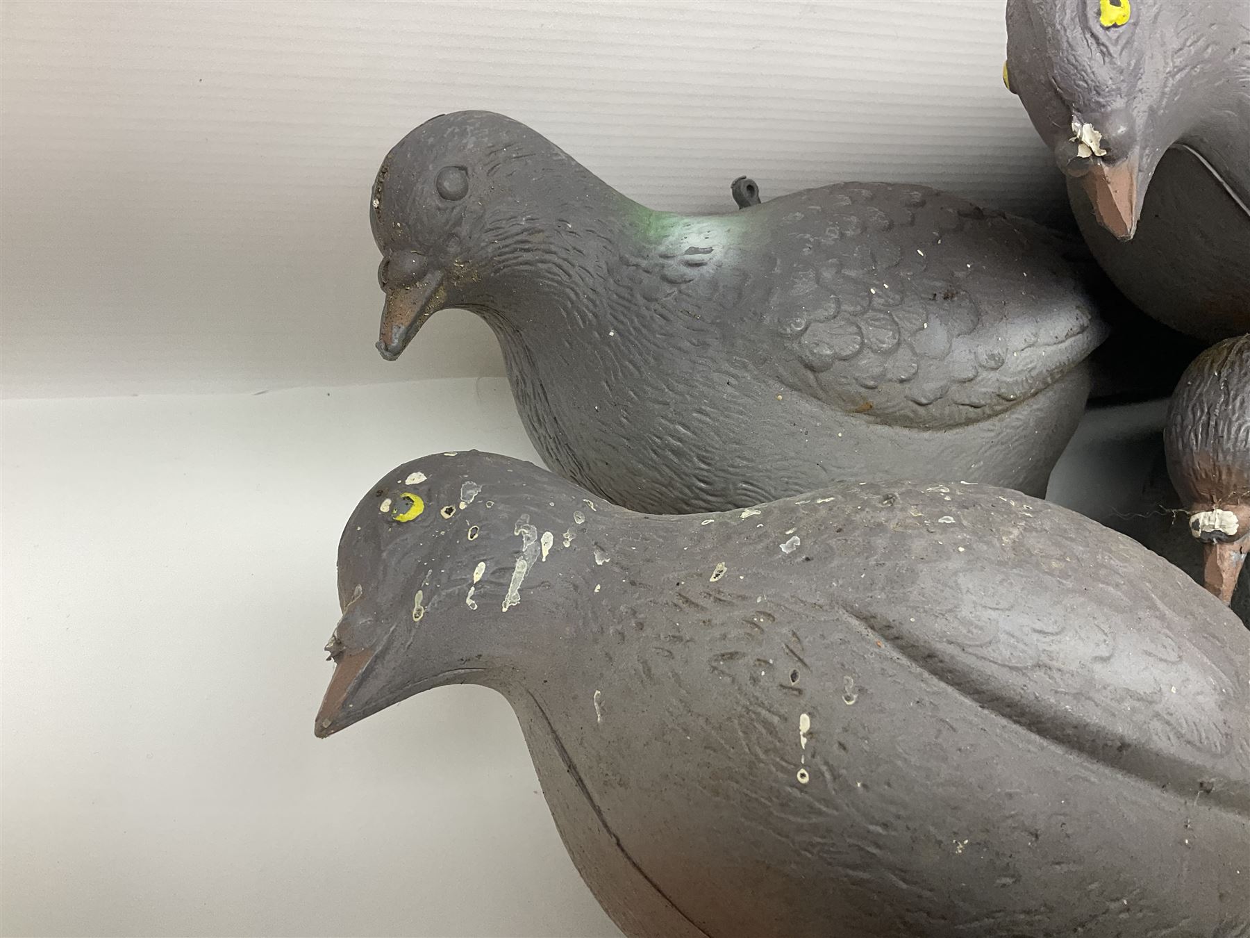 Eighteen plastic pigeon decoys comprising ten full body and eight shells with quantity of various stakes; some marked made in Italy