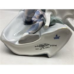 Lladro figure, Jester Serenade, modelled as a ballerina with bouquet of flowers seated before a jester playing the violin, limited edition 2541/3000, sculpted by Antonio Ramos, no 5932, with original box, year issued 1993, year retired 1994, H37cm