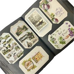 Postcard album with Victorian and later postcards, including silk cards, landscapes of the UK, portraits, Christmas cards etc  