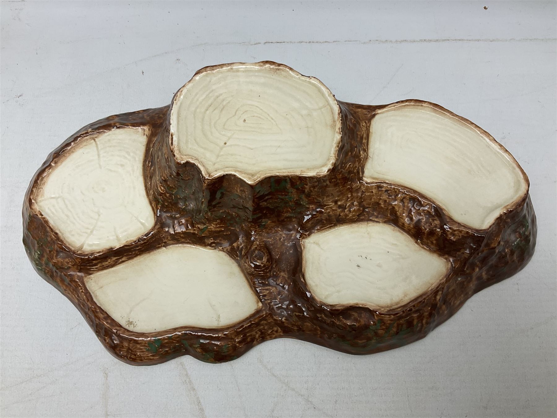 Seven Beswick Beatrix Potter figures, comprising Sally Henny Penny, Johnny Town-Mouse, Mrs Tiggy-Winkle, Mrs Tittlemouse, Tom Kitten, Pig-Wig and Squirrel Nutkin, together with a Beswick tree trunk display stand, stand L30cm